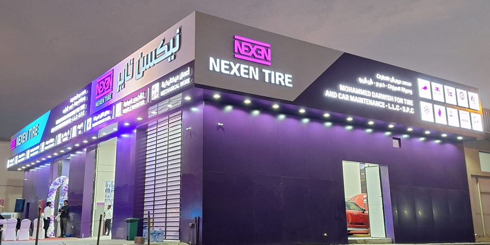 NEXEN TIRE branded shop exterior showcasing purple signage and global brand identity rollout