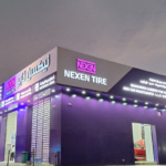 NEXEN TIRE branded shop exterior showcasing purple signage and global brand identity rollout
