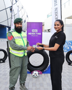 NEXEN Tires fan activation football challenge zone at Al Nasr Stadium Dubai with supporters participating in tire goal games