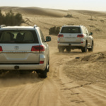 A high-capacity AGM battery installed in a Toyota Land Cruiser engine bay, designed to handle dual AC units and extreme Dubai heat.