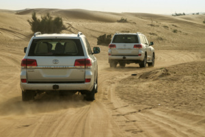 A high-capacity AGM battery installed in a Toyota Land Cruiser engine bay, designed to handle dual AC units and extreme Dubai heat.