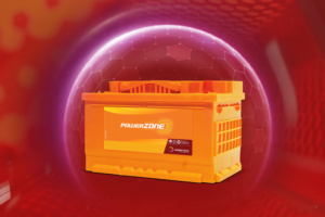 Saeedi Pro technician using a digital tester to check a battery's Cold Cranking Amps (CCA) and health status in a Dubai workshop.