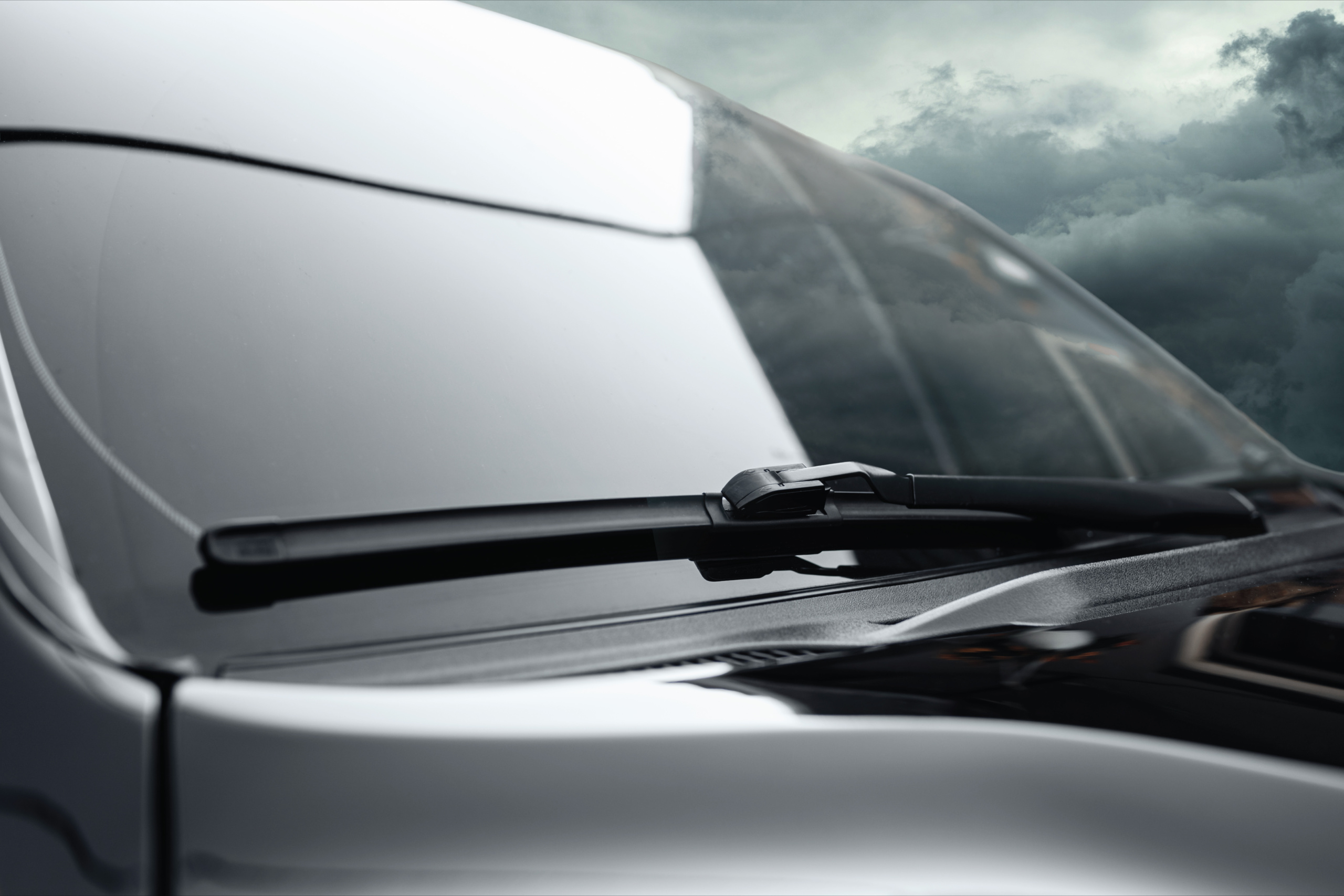 A car driving on Sheikh Zayed Road (E11) with clean windshield wipers installed by Saeedi Pro.