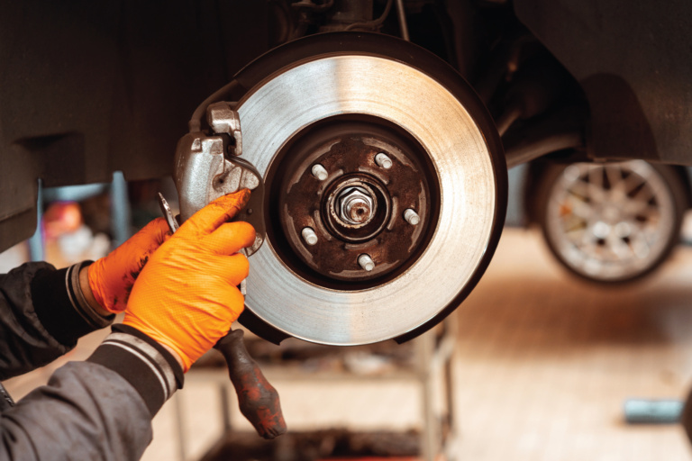 Worn brake disc and pad showing heat damage from UAE driving