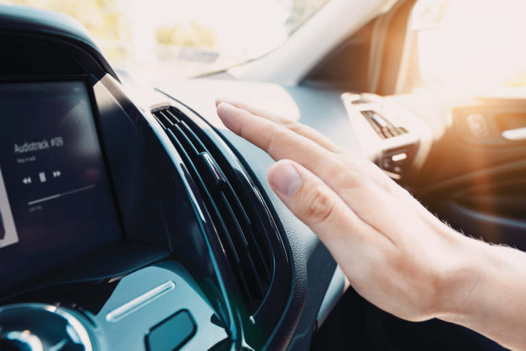 Car air conditioning vents being checked during UAE summer heat